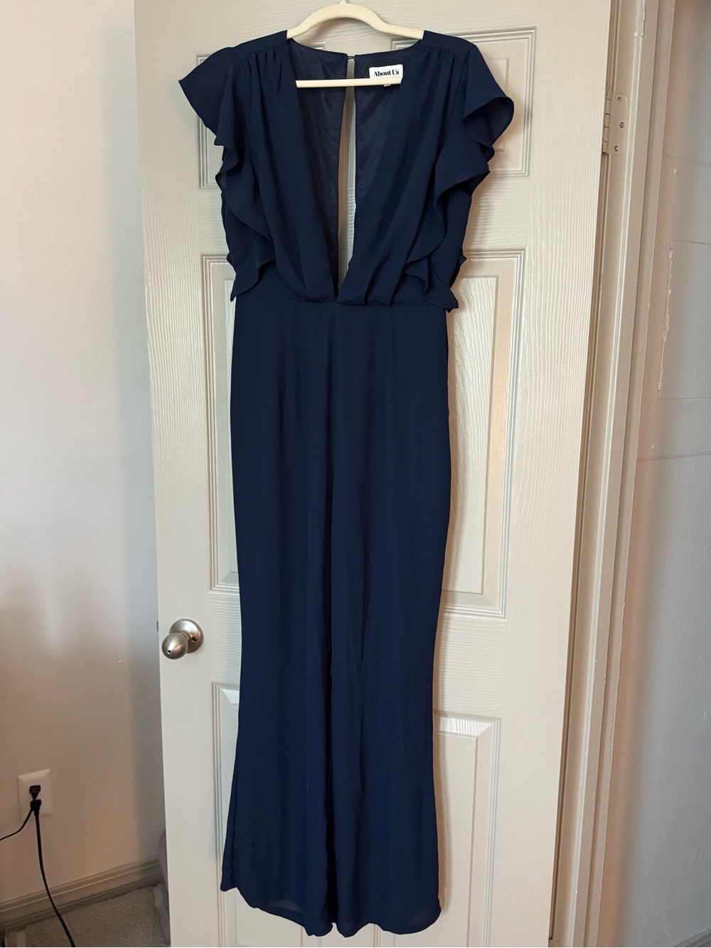 About Us Navy Ruffle Sleeve Jumpsuit